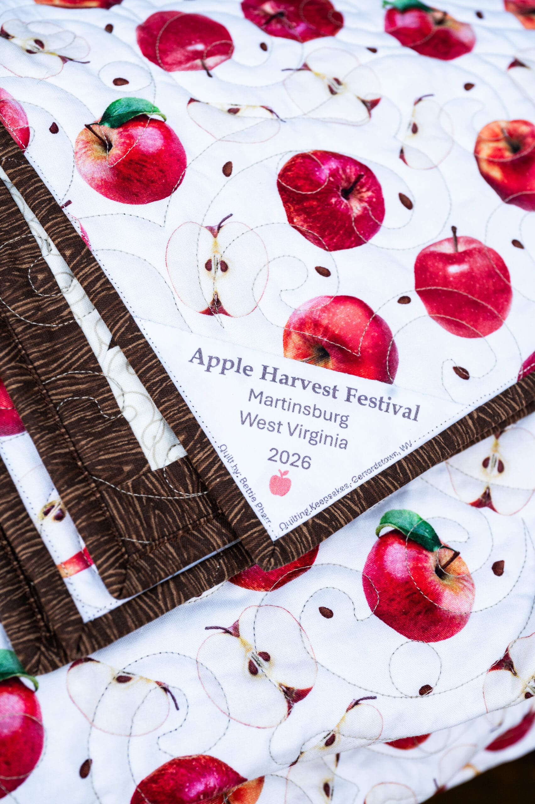 The 2026 raffle quilt backing with embroidered label