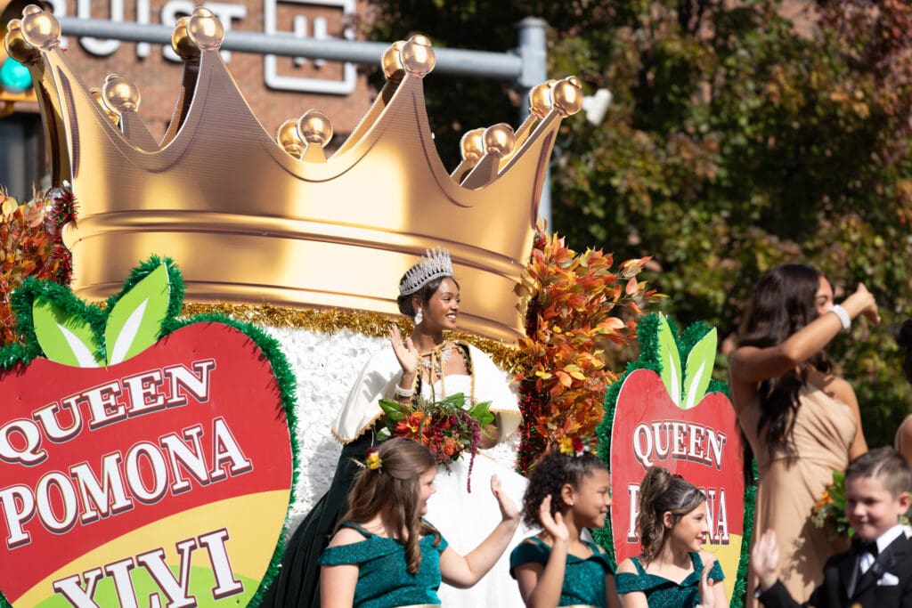 Queen Pomona on the crown float in the Grand Feature Parade